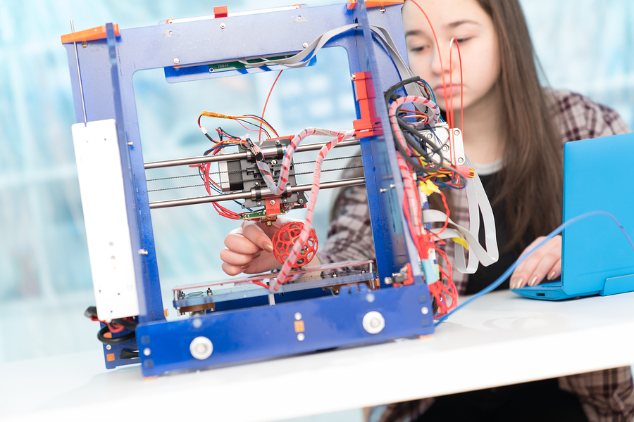 Young woman, schoolgirl print 3D model on 3D printer