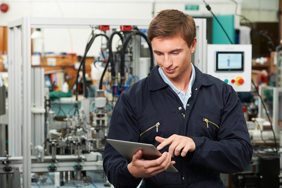 Male Engineer In Factory Using Digital Tablet