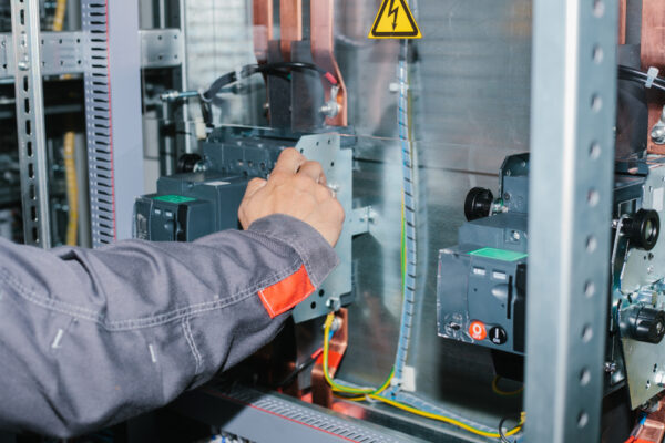 Electrician Specialist Checking Low-voltage Cabinet Equipment