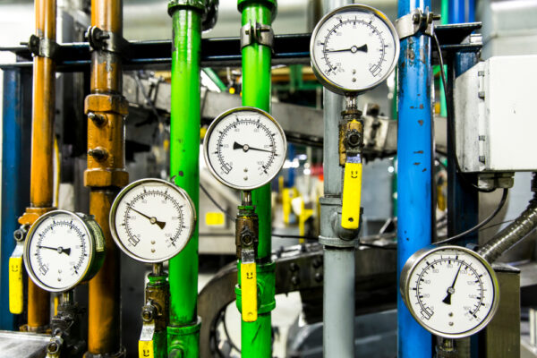 Pressure Gauge Measuring Instrument Close Up. Hydraulic Pressure Gauges