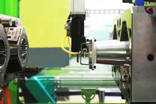 The Finished Part Is Removed From The Injection Molding Machine