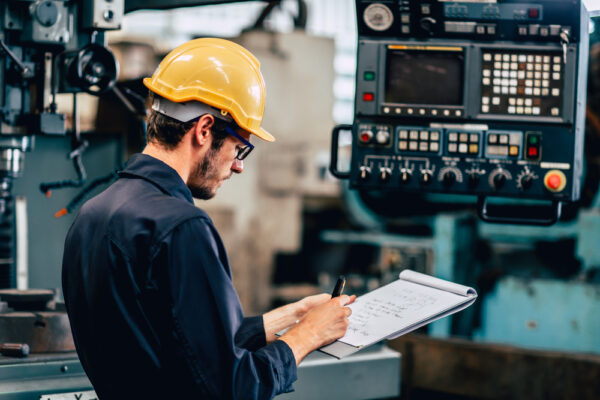 Young Profession Technician Engineer Operating Heavy Machine