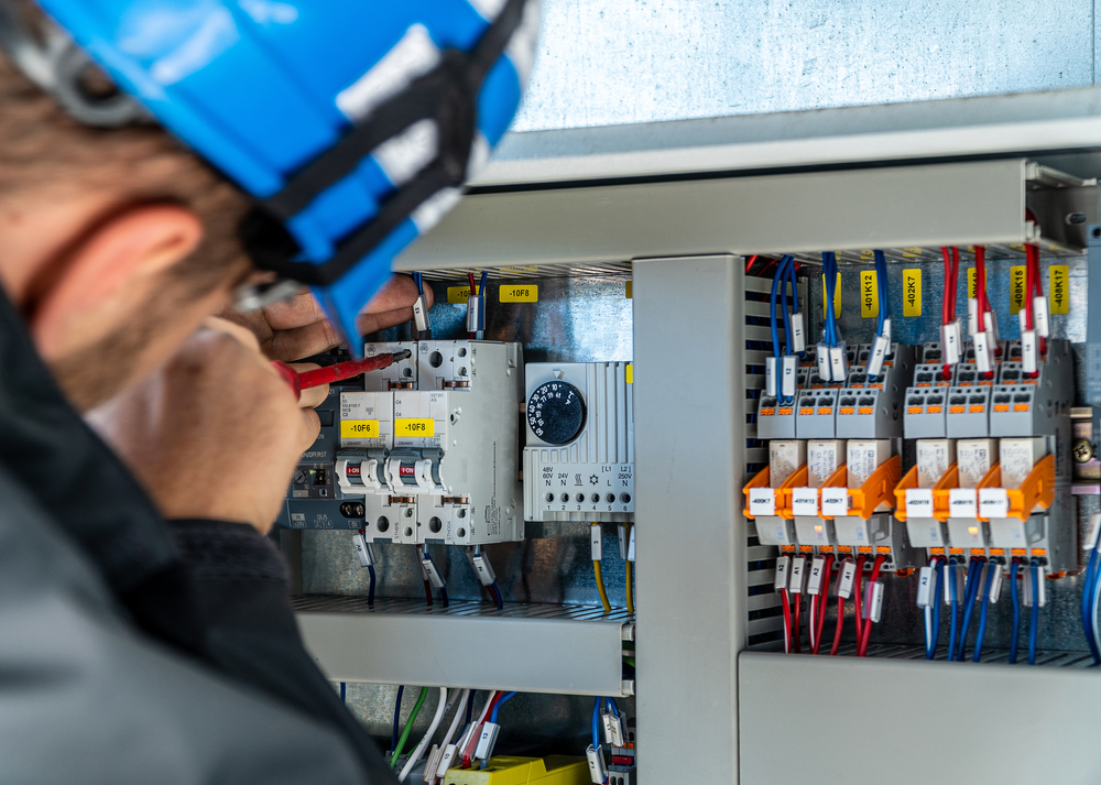 A Engineer Repairing Electrical Installation