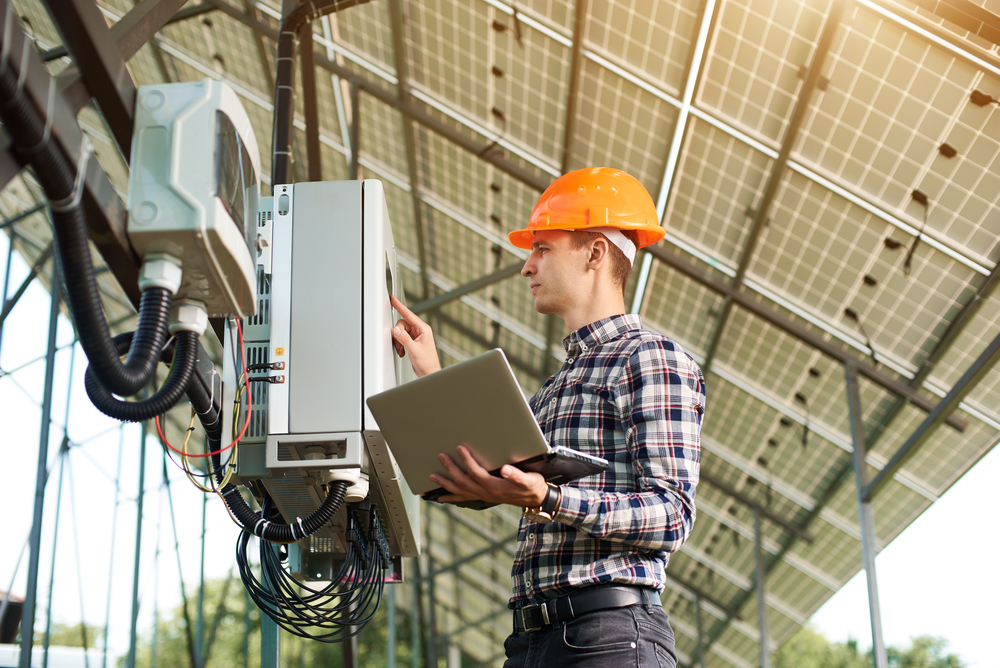 Expert Is Inspecting Quality Of Solar Panels