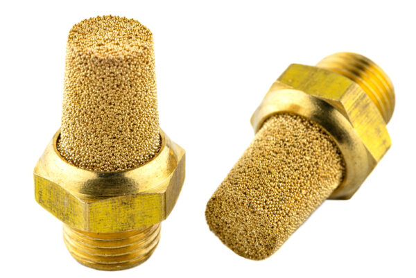 Macro Shots Of Two Air Silencers Caked With Brass Balls