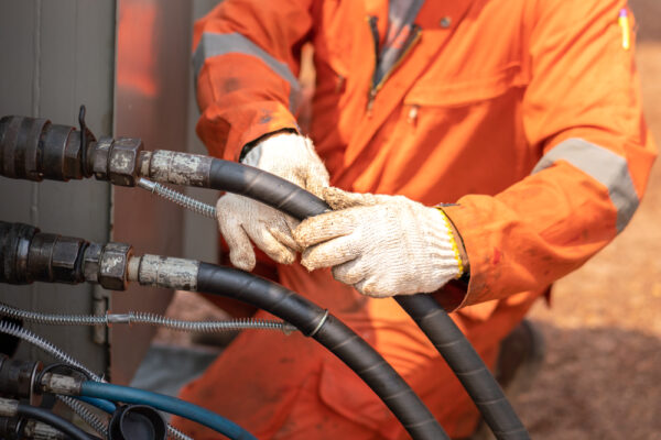 Worker Is Connecting And Checking High-pressure