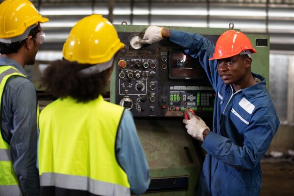 Foreman Training And Teaching How To Use Machine