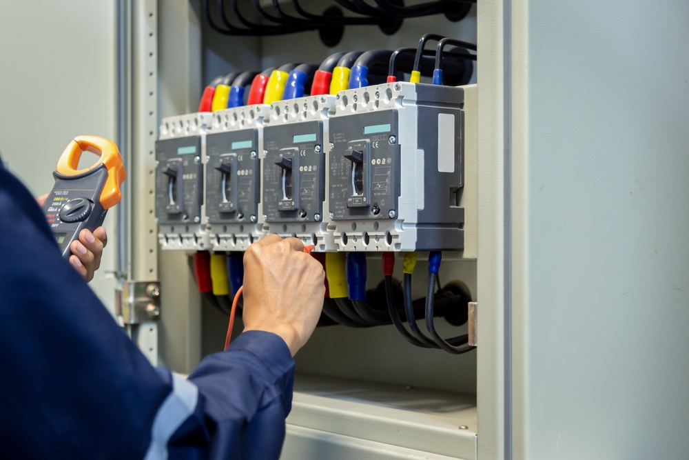 Electrical Engineer Using Measuring Equipment To Checking Electric Current Voltage