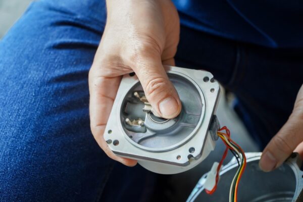 Mechanic Repairing AC Servo Motor