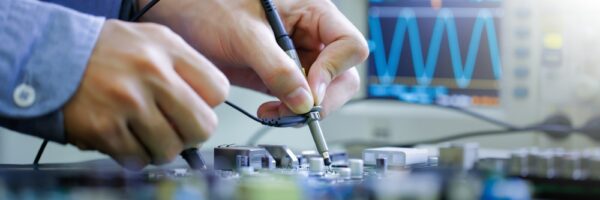 Electronic Technician Repairing Electronic Device