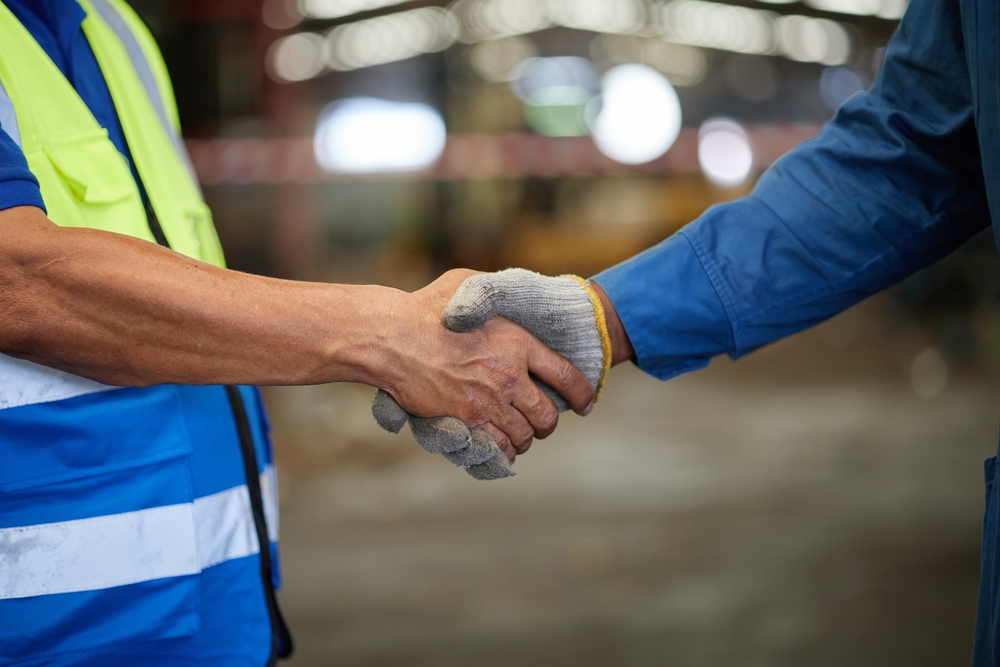 Closeup Worker Shaking Hands With Customer