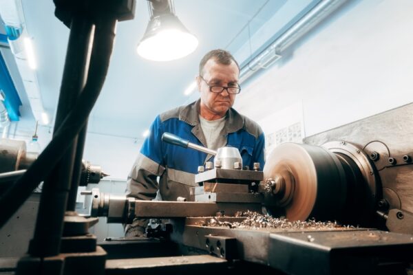 Elderly Worker At Lathe