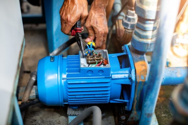 Selective Focus To Hand Of Plumber Repair And Remove Motor