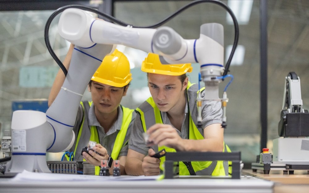 Trainees Intensely Focus On Robot Arm
