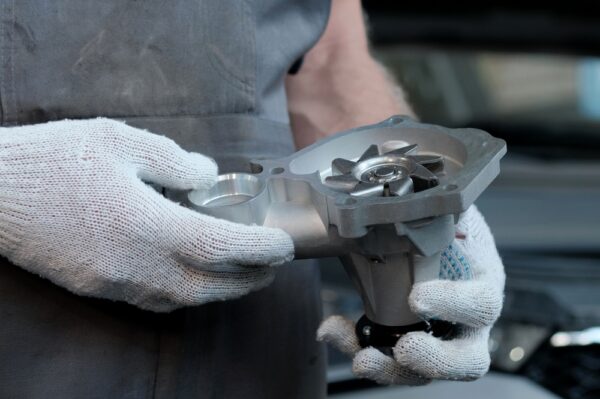 Mechanic Holds parts