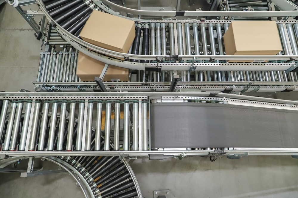 Packing Line In A Logistics Warehouse. Conveyor Belt