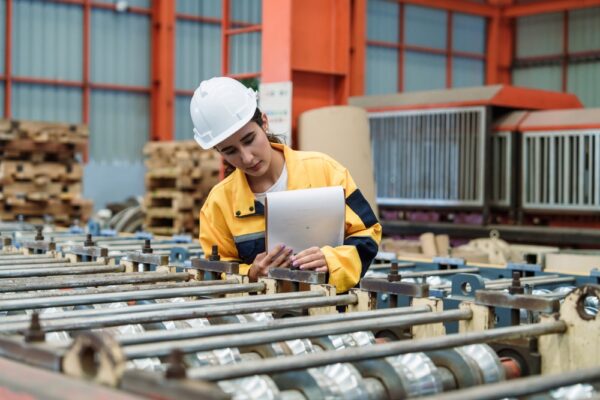 Industrial Engineer Manager Holding Clipboard Checking Quality Metal At Industry
