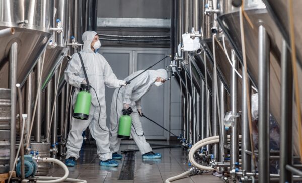 Workers In Hazmat Suits