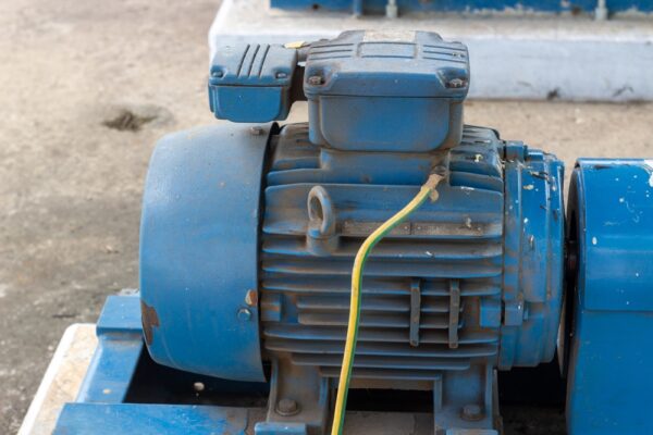 Close-up Of A Weathered Blue Chemical Industrial Electric Motor