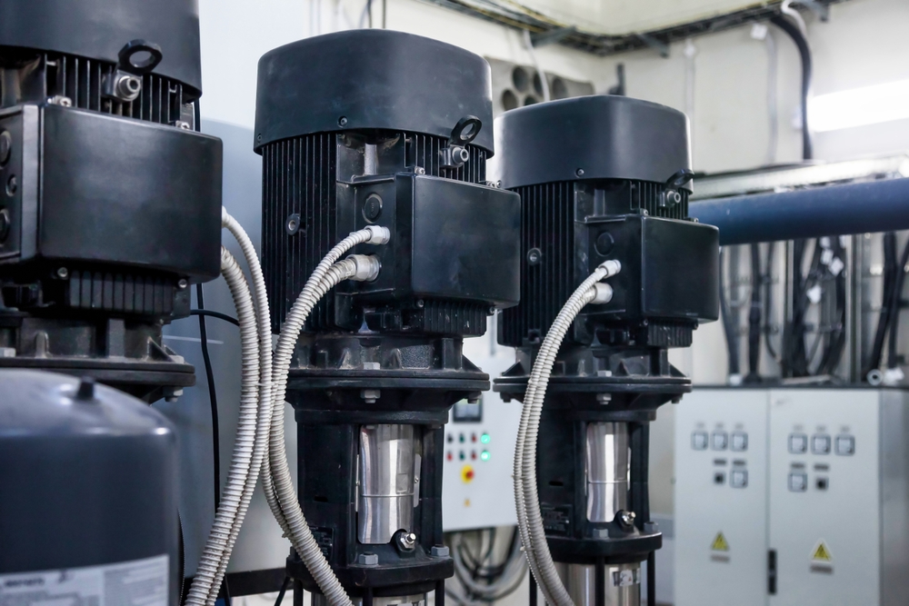 Three Motors Are Positioned Prominently In A Well-lit Indoor Space