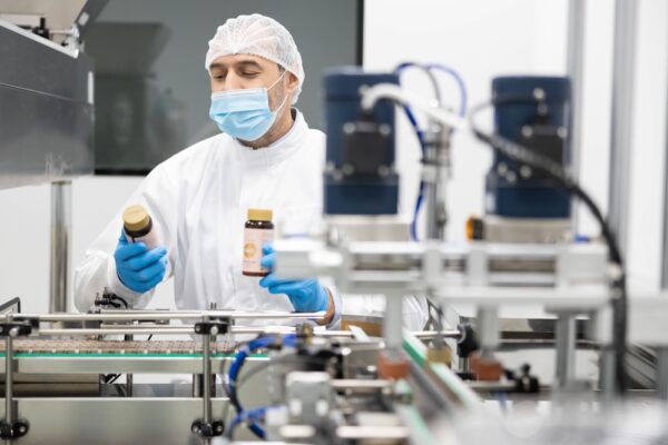 A Focused Worker In A Clean Room Environment