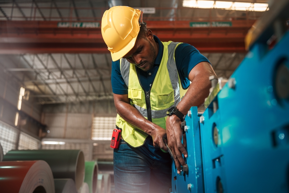 Manufacturing Technician And Worker Performing Machine Maintenance