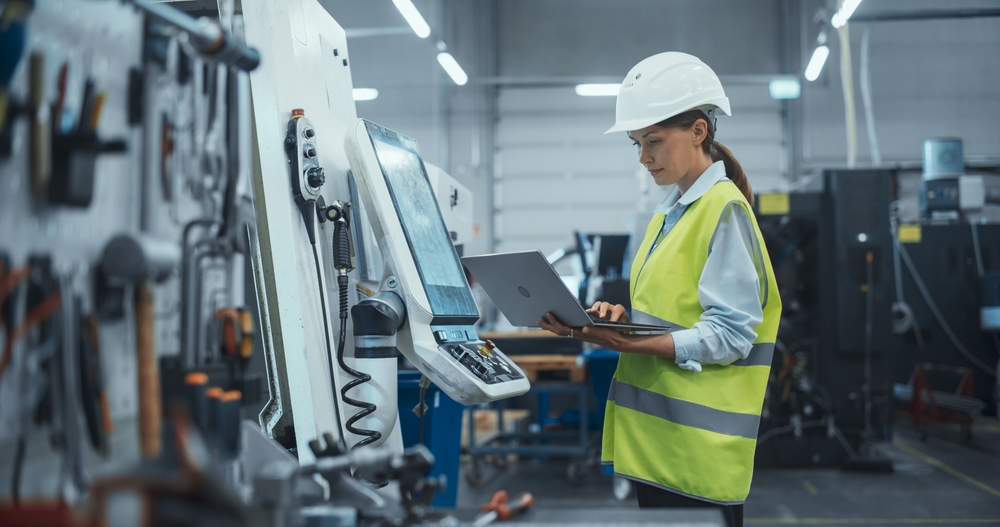 Machinery Technician Using Laptop