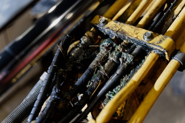 Contaminated Hydraulic Line Assembly With Degraded Coating Cracked Hoses And
