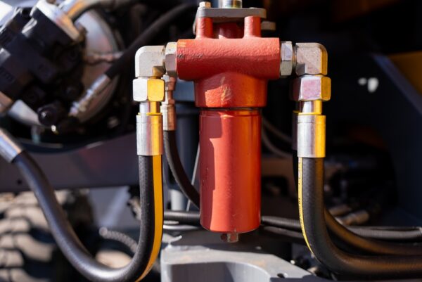 Red Hydraulic Filter Assembly With Hoses And Metal Fittings