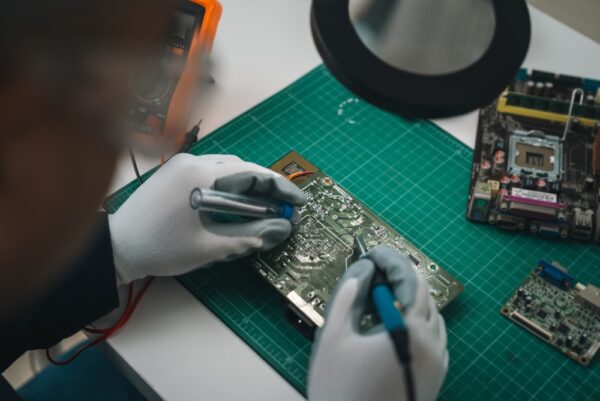 Circuit Board Repair Technicians Solder Electrical Connections Inspect Damaged Areas