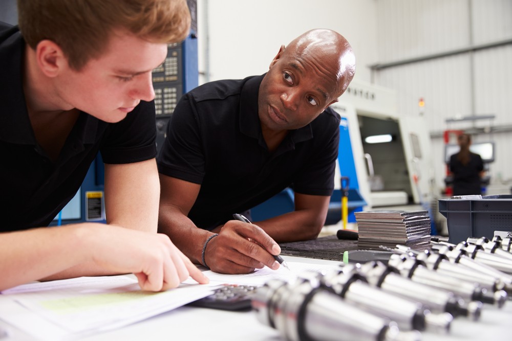engineer and apprentice planning cnc